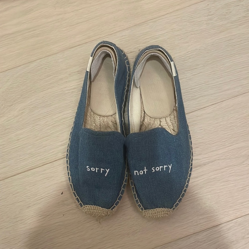 Barely worn Soludos with phrase “sorry, not sorry”